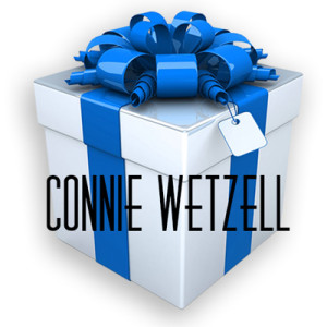 Gift box with blue ribbon and tag.